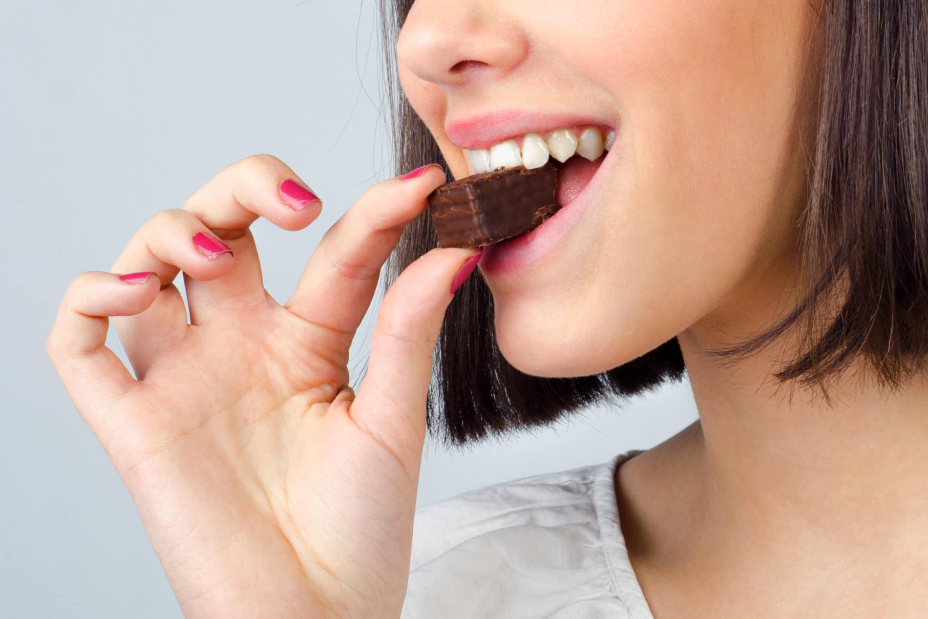 girl enjoying her chocolate bite