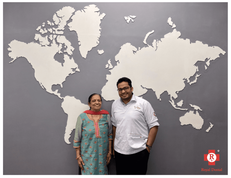 patient and doctor happily smiling - dental surgeons medical doctors