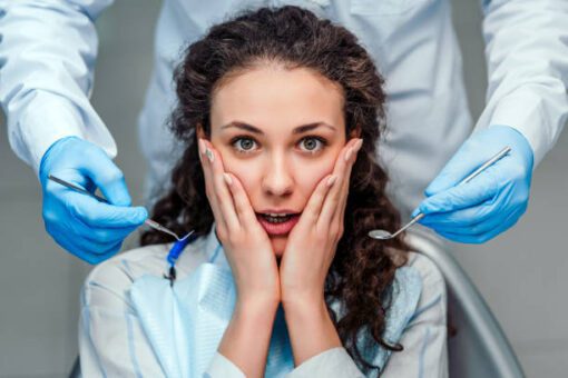 The girl is afraid of the dentist