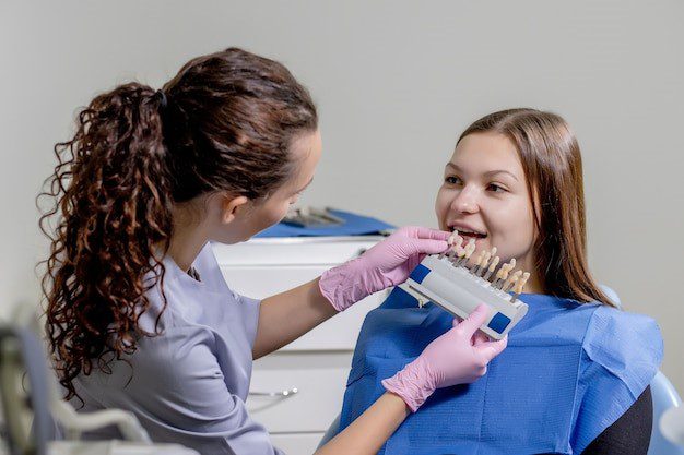 Dentist checking Veneers